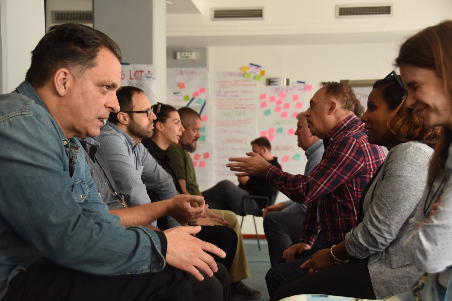 Locally led development practitioners in discussion at a regional learning summit