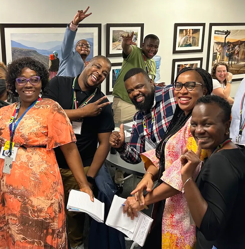 A group of smiling people at a regional learning summit